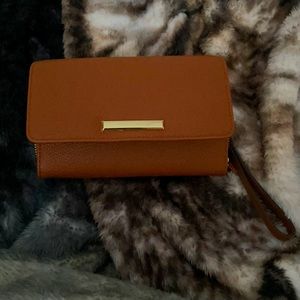 Color is kind of a dark brown. The brand is, Kate Landry.